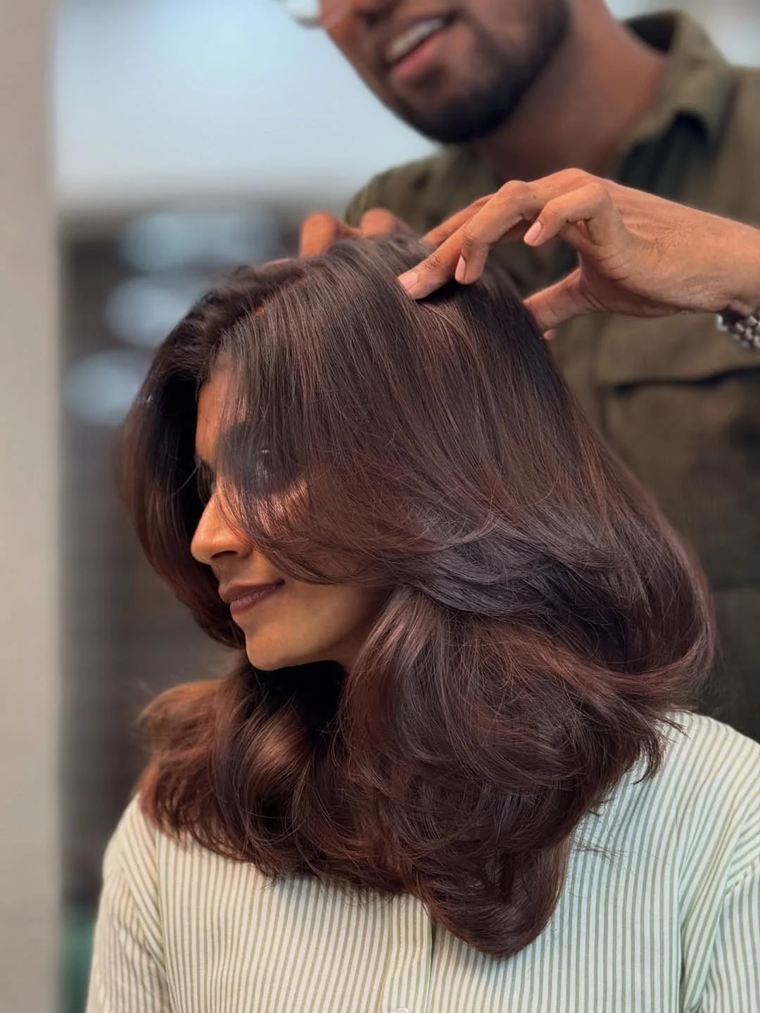 versatile summer haircuts for medium hair 2026 Glossy Layered Blowout with Volume