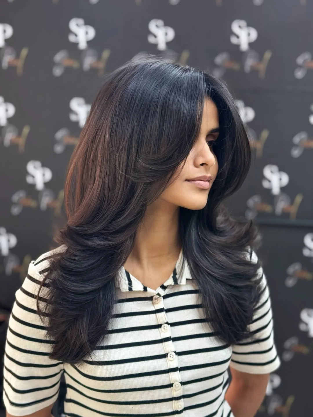 versatile summer haircuts for medium hair 2026 Layered Butterfly Blowout with Drama