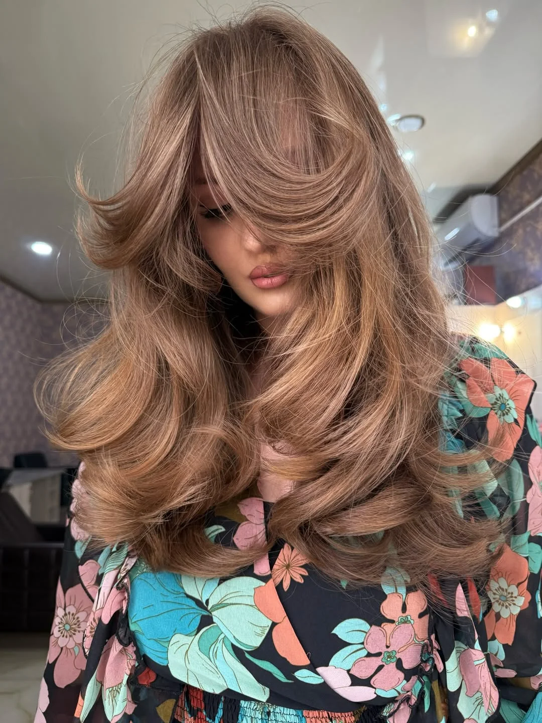 youthful summer haircuts for women over 40 2026 Airy Butterfly Layers with Voluminous Bangs