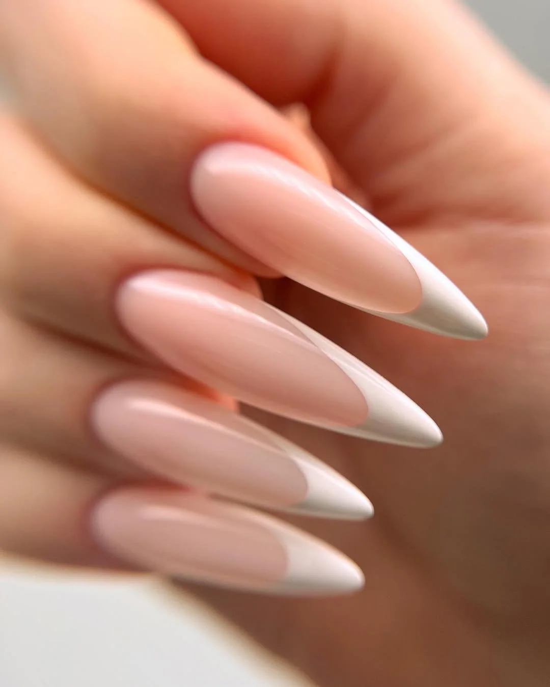 chic light summer nails 2026 Soft White French Stiletto Elegance