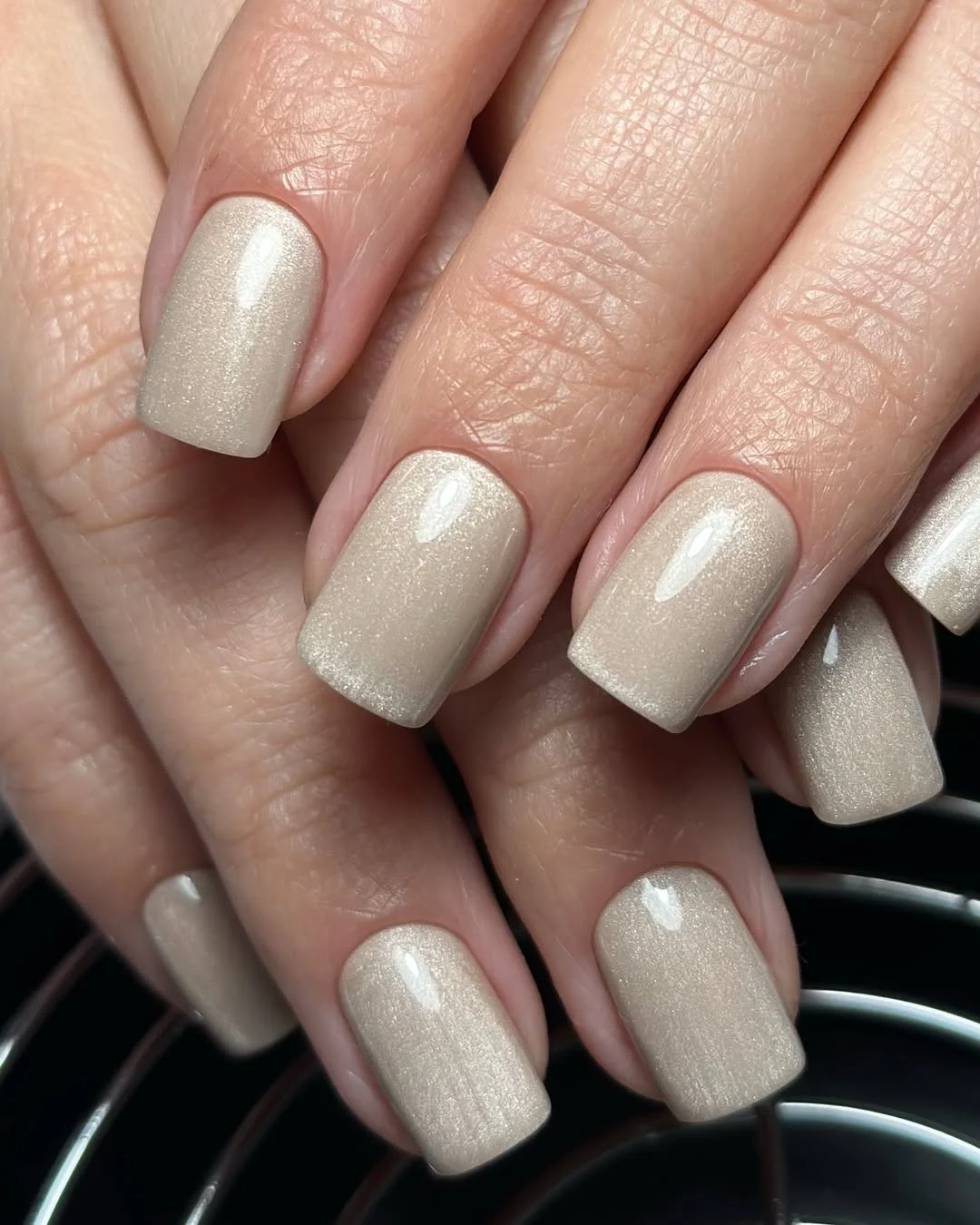 chic light summer nails 2026 Champagne Shimmer Nails with a Luxury Glow