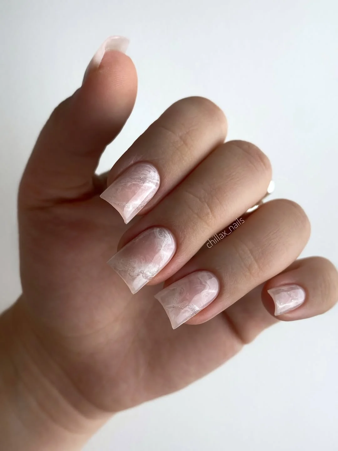 chic light summer nails 2026 Milky Marble Elegance in Whisper White