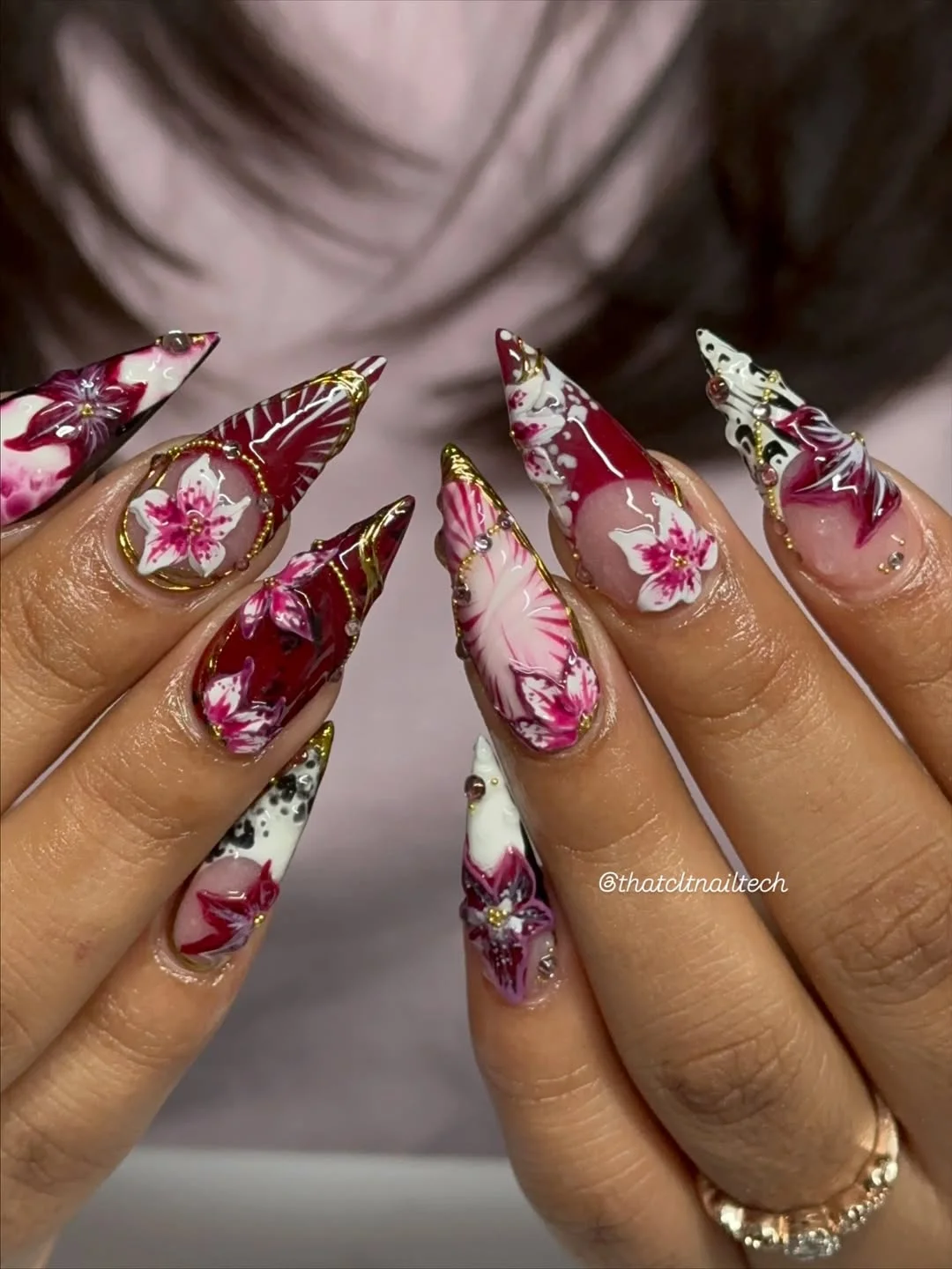 chic summer stiletto nails 2026 Burgundy Floral Art With Luxe Details