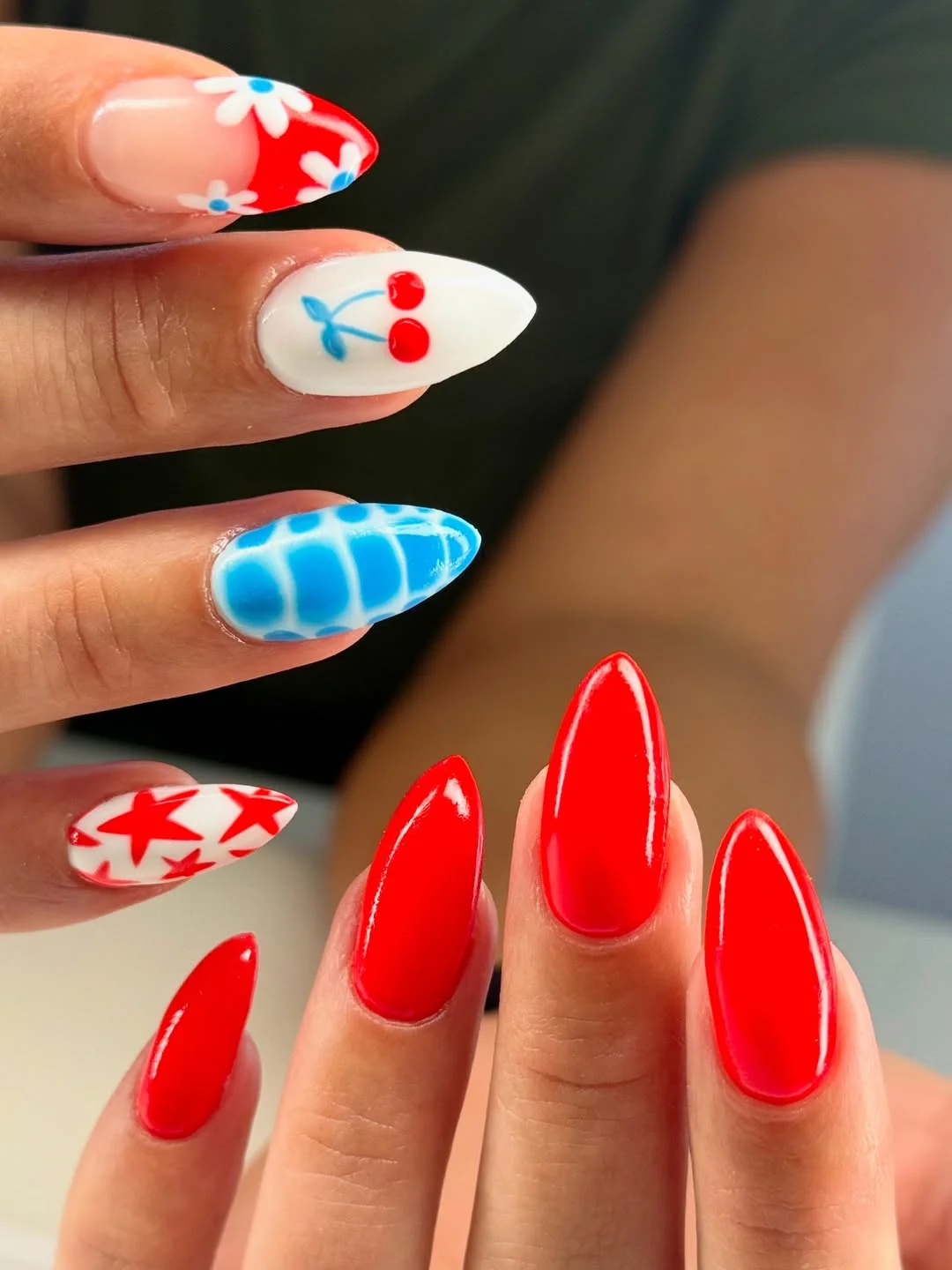 cool 4th of july nails 2026 Bold Cherry Red Almond Nails With Airbrushed Blue Art
