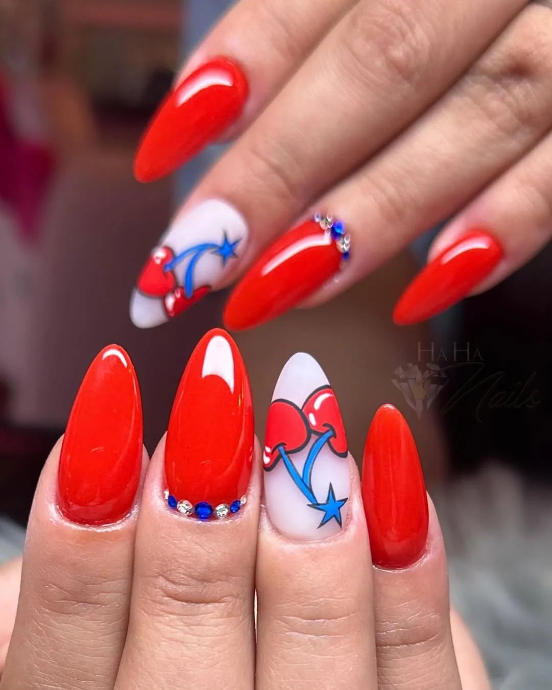 cool 4th of july nails 2026 Glossy Cherry Red Nails With Minimal Firework Art