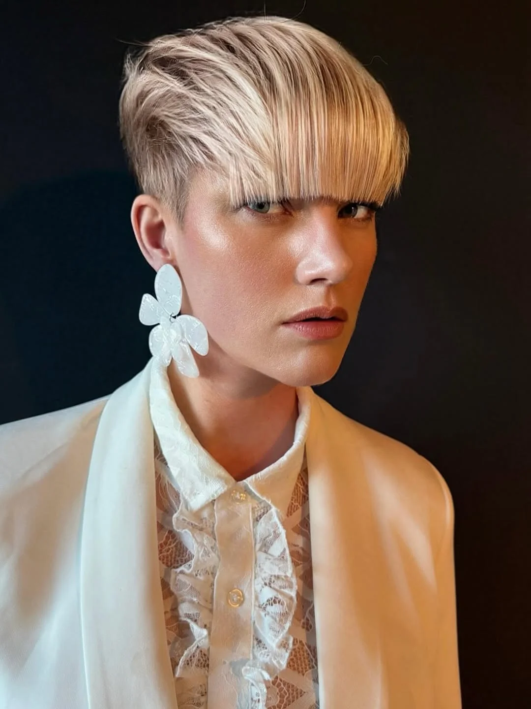 cool summer hair color for light skin 2026 Textured Undercut Pixie with Graphic Fringe