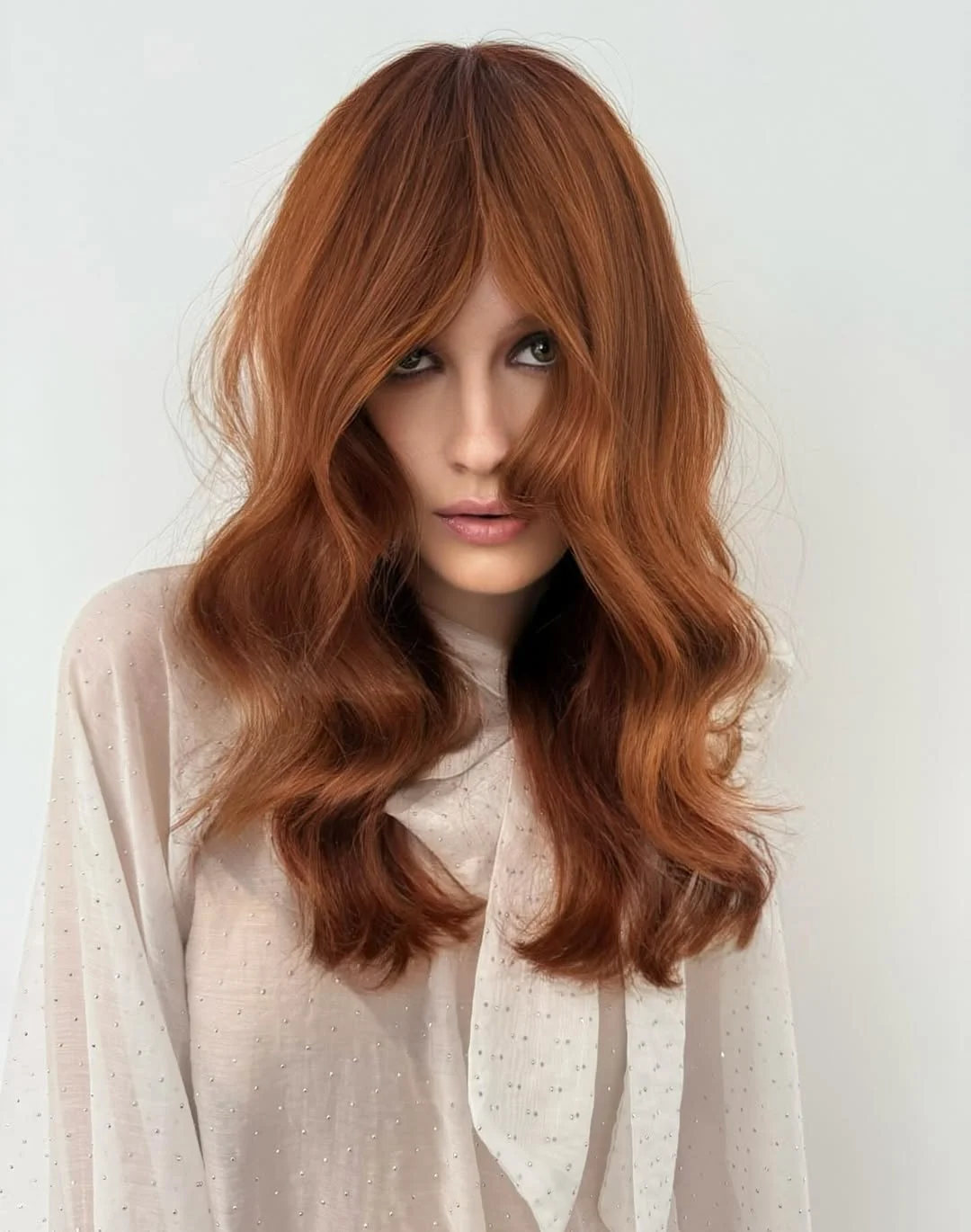 cool summer hair color for light skin 2026 Soft Auburn Layers with Airy Movement