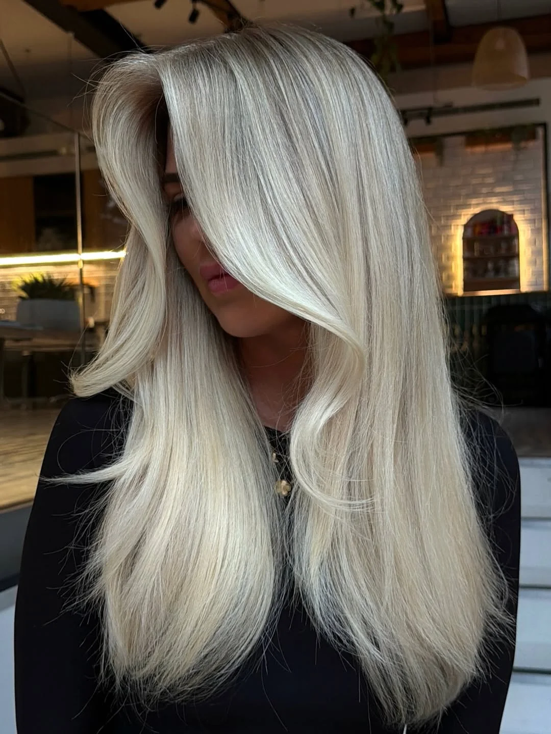 creamy summer blonde hair color 2026 Bright Platinum Silk with Face-Framing Layers