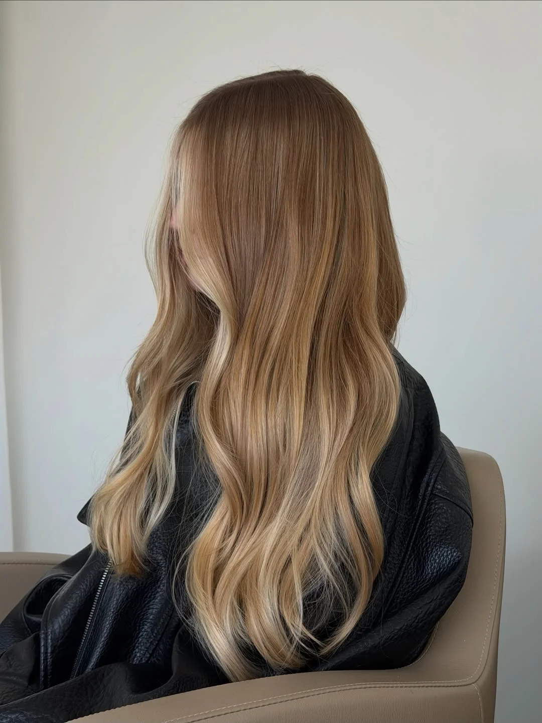 creamy summer blonde hair color 2026 Sunlit Bronze Blonde with Soft Waves