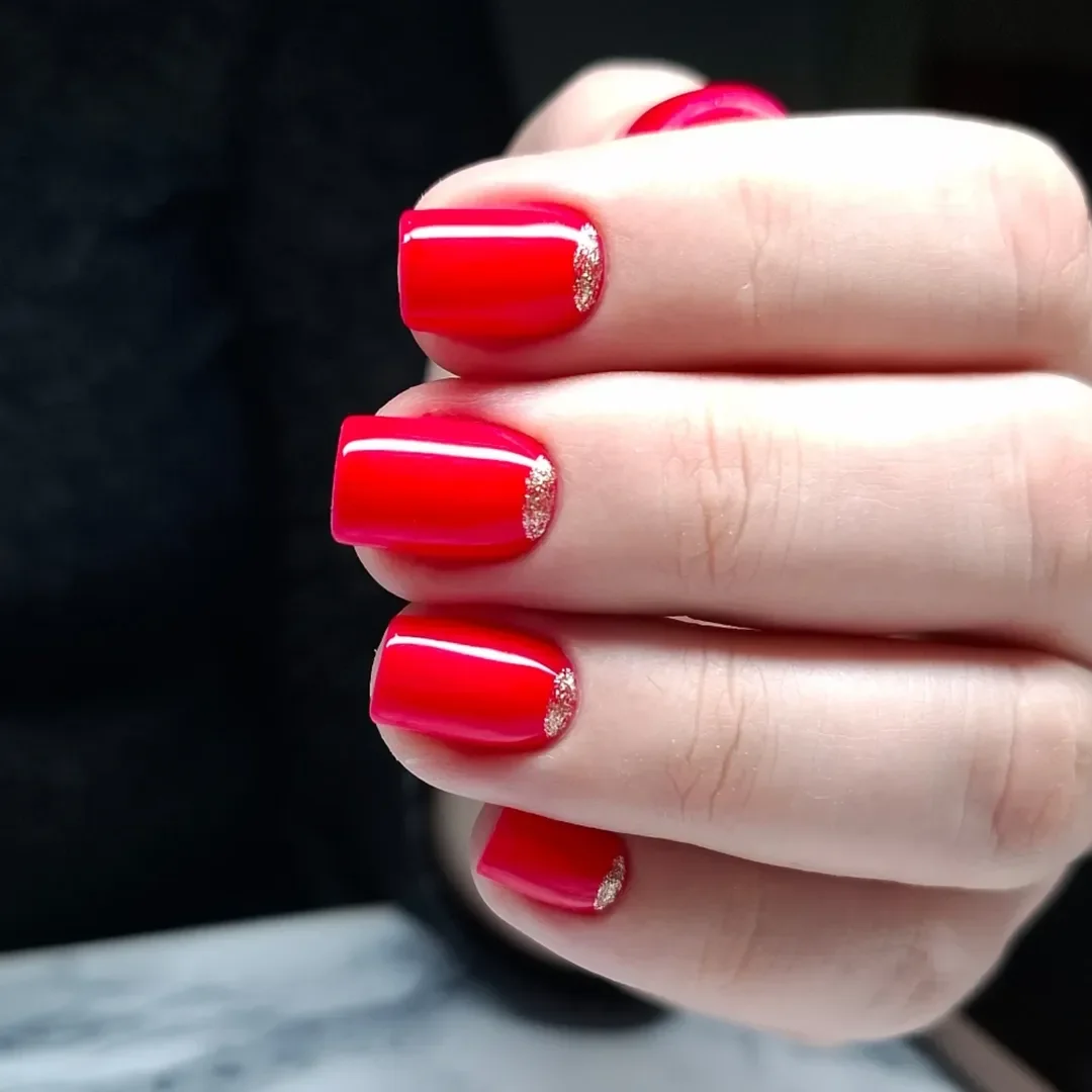 cute bright summer nails 2026 Glossy Coral Red with a Touch of Gold