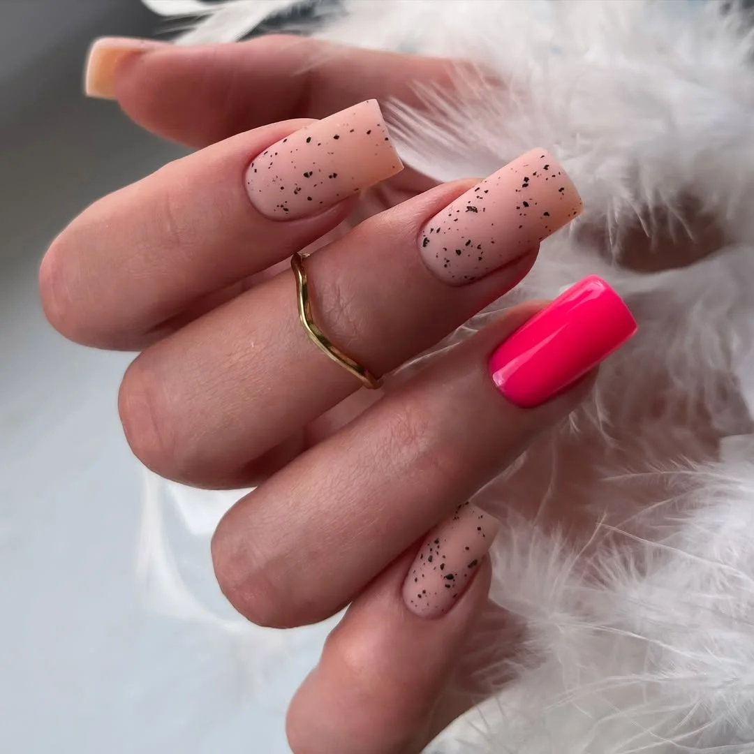 cute bright summer nails 2026 Hot Pink Accent With Speckled Nude