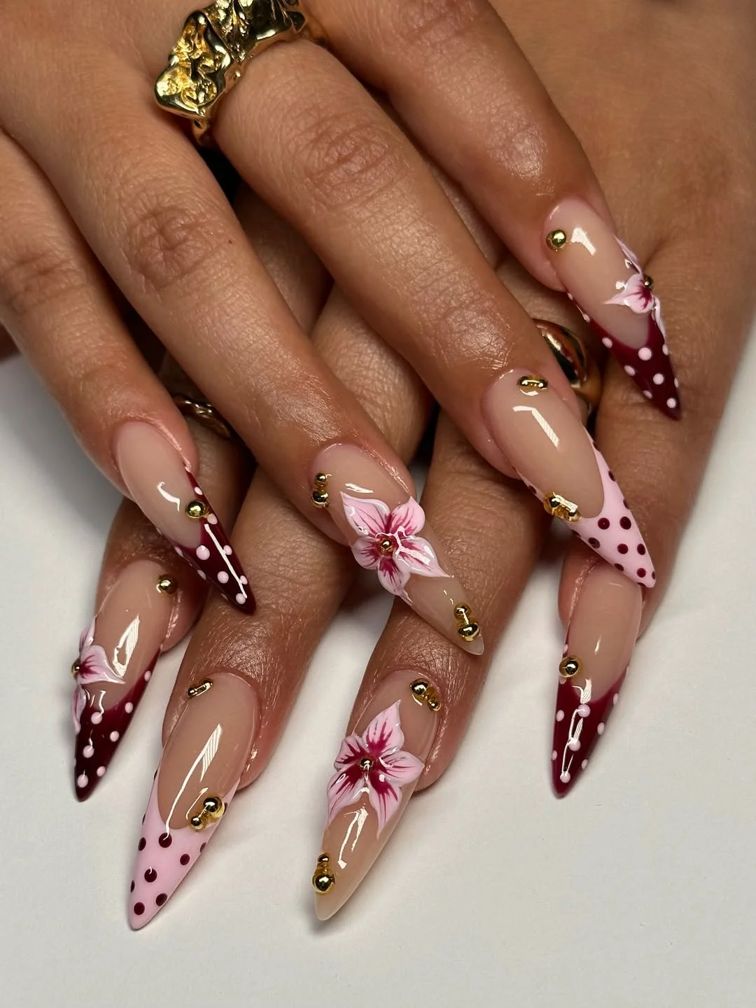 cute polka dot summer nails 2026 Pink Floral French Tips With Gold Studs