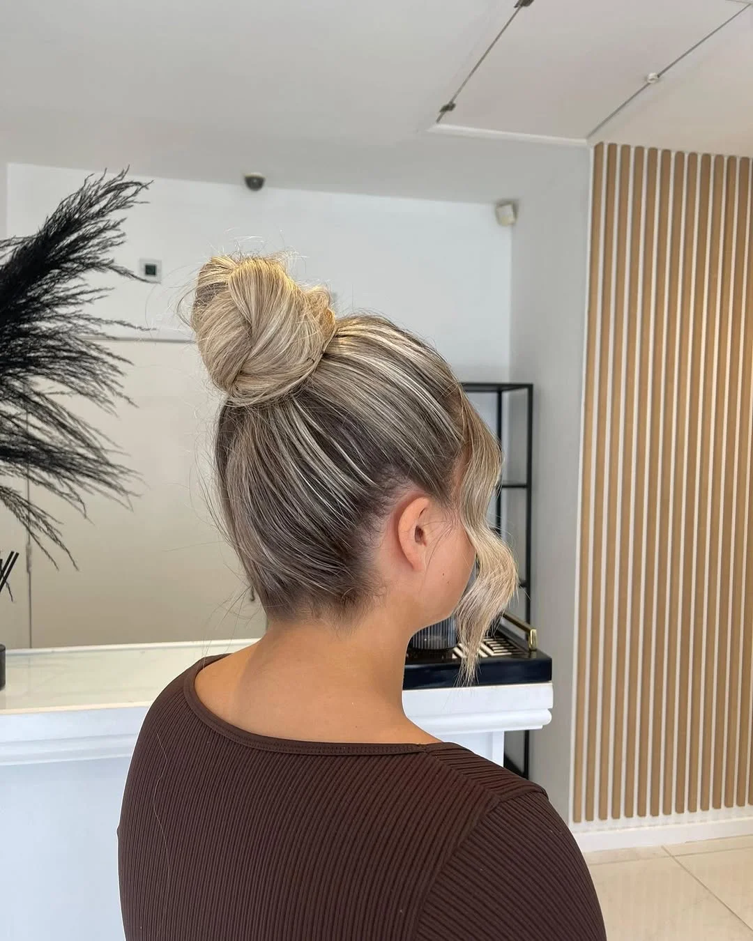 easy summer hairstyles ideas 2026 Sleek Summer Bun With Soft Face-Framing Waves