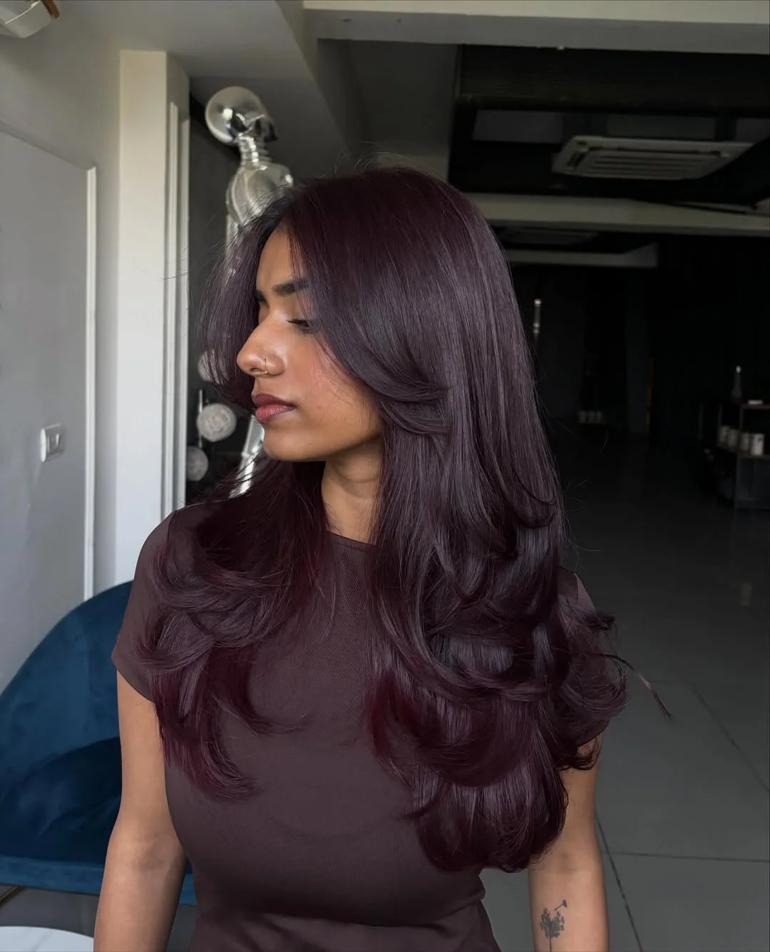 gorgeous summer hair color ideas 2026 Plum Brunette Waves with Cool Undertones