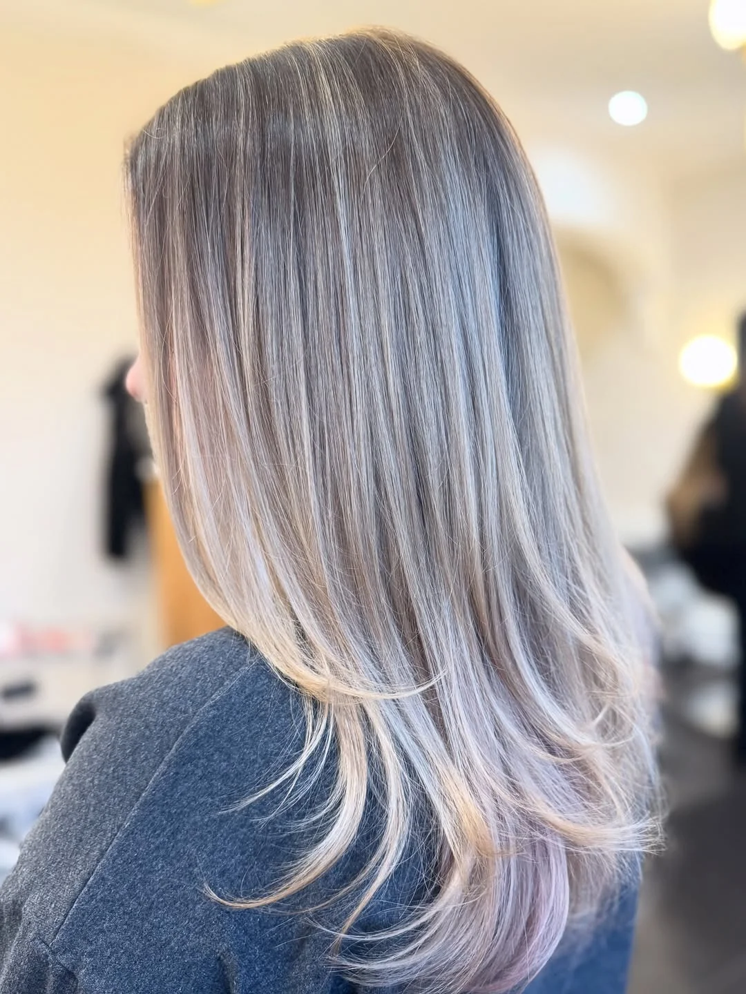 icy summer ash blonde hair color 2026 Feathered ash lengths with airy beige softness
