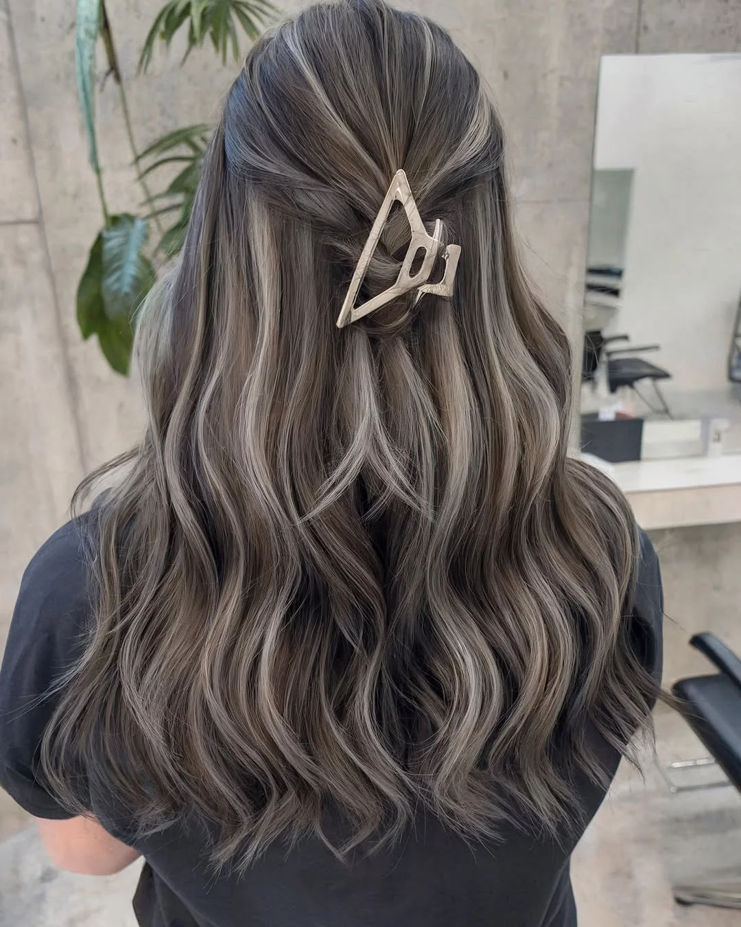 icy summer ash blonde hair color 2026 Deep ash waves with soft clip styling