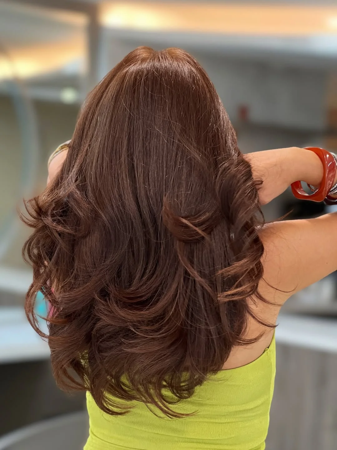low maintenance summer hair color for brunettes 2026 Rich Auburn Brunette With Glossy Retro Volume