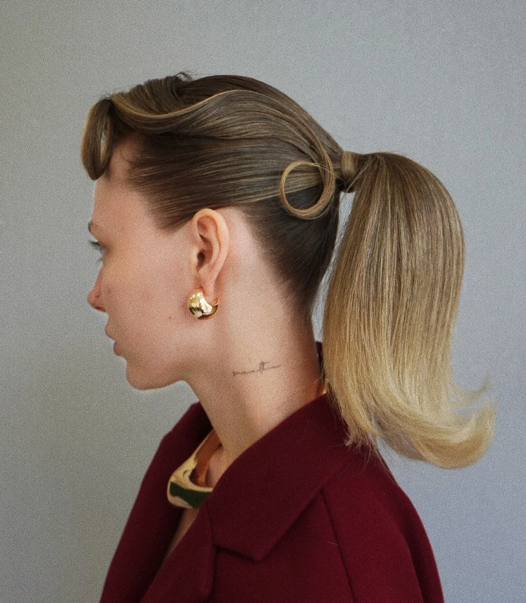 low summer ponytail hairstyle 2026 Retro Sleek Ponytail With Sculpted Details