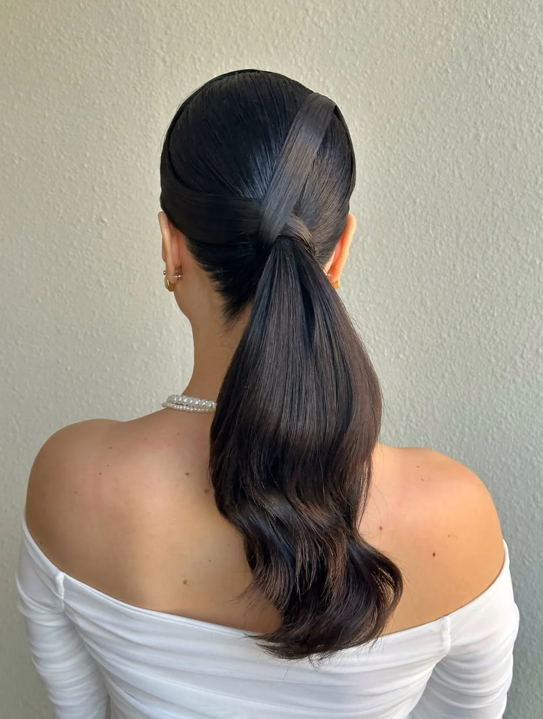 low summer ponytail hairstyle 2026 Ultra Sleek Ponytail With Wrapped Detail