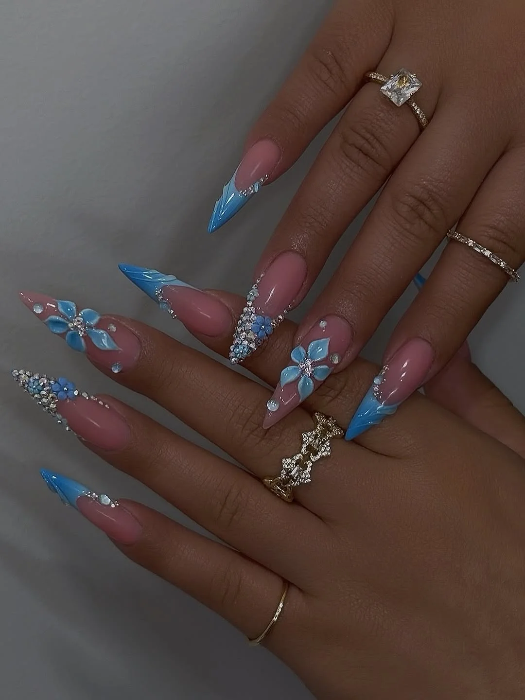 modern summer glitter nails 2026 Bright Blue Floral Stiletto Sparkle