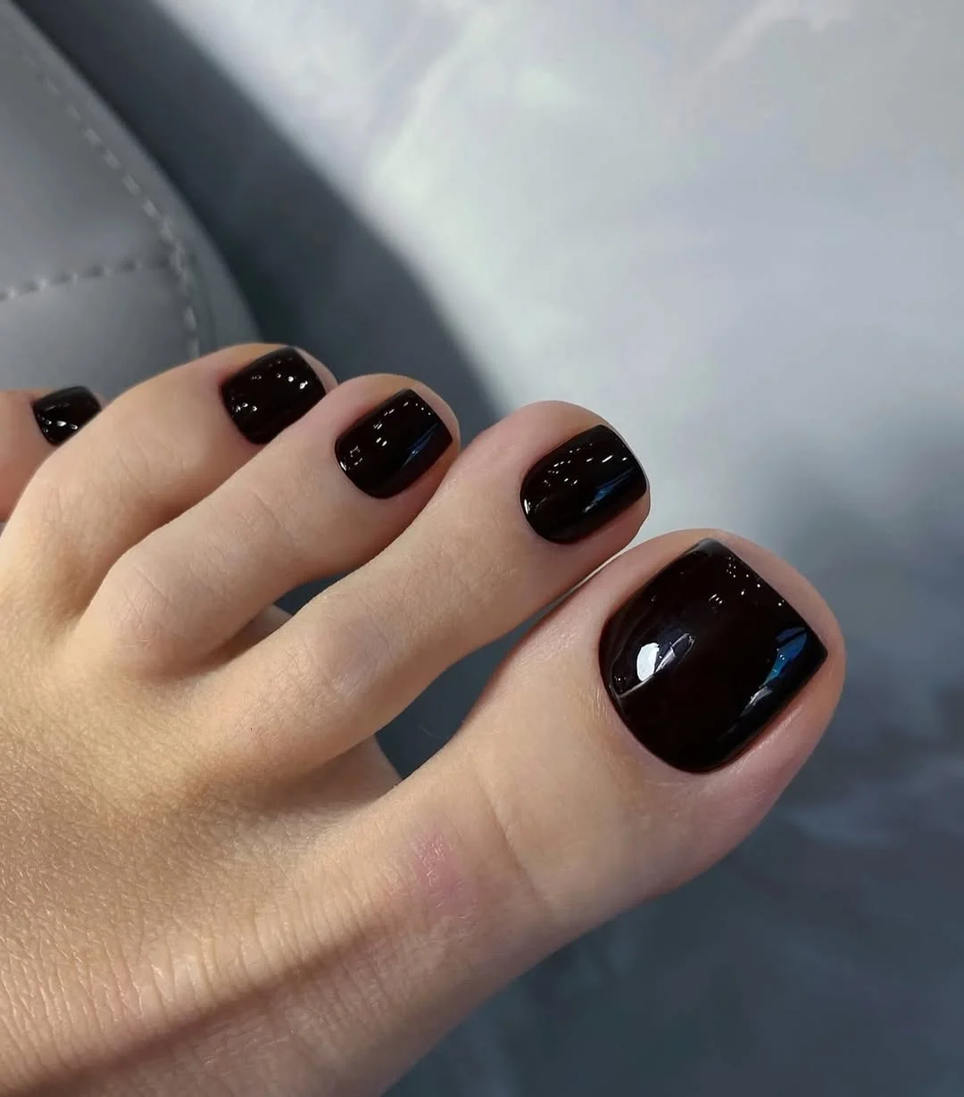 pedicure ideas summer trends 2026 Glossy Black Toenails That Feel Unexpectedly Chic