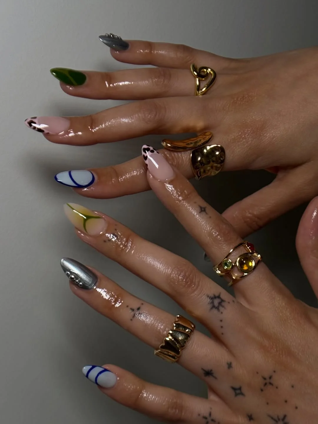 pretty summer almond nails 2026 Mixed Color Almond Nails with Artistic Curves