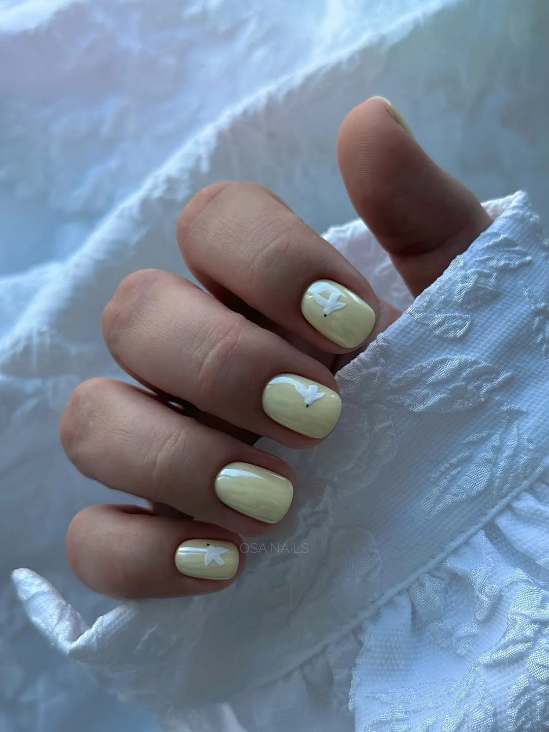 short summer nails 2026 Soft Butter Yellow With Tiny White Butterflies