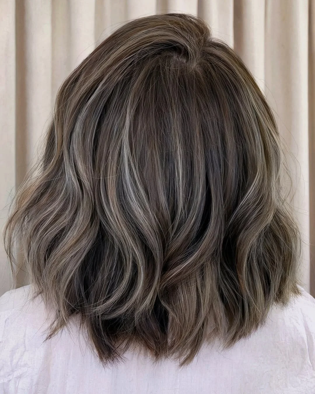 smoky summer ash brown hair color 2026 Textured smoky lob with modern balayage