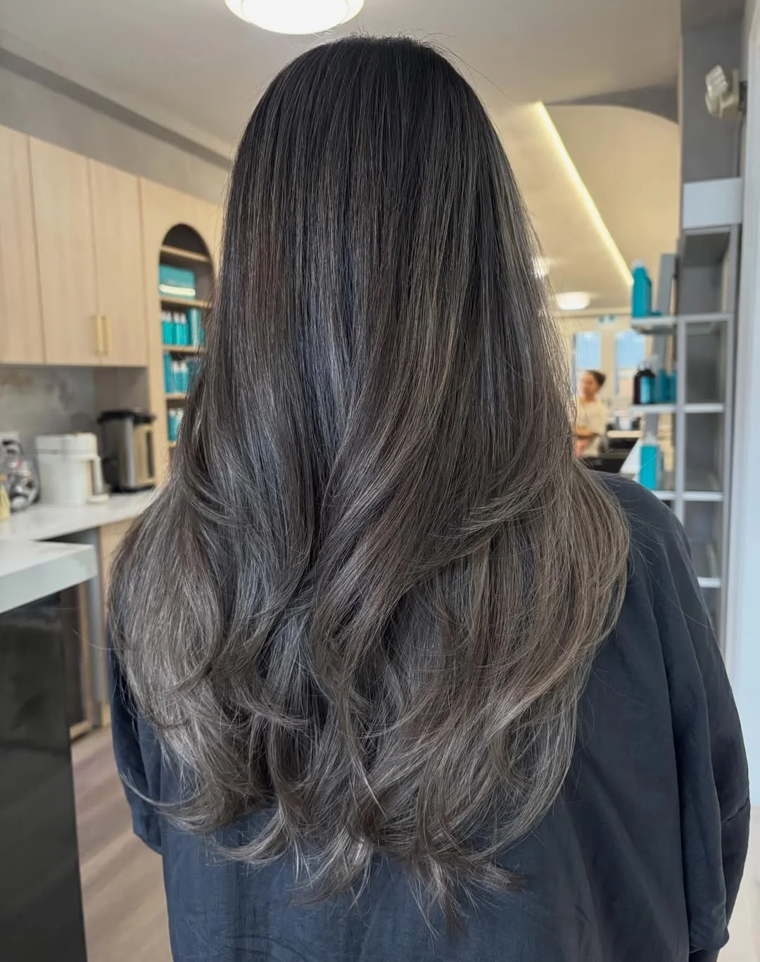 smoky summer ash brown hair color 2026 Deep smoky brunette layers with natural volume