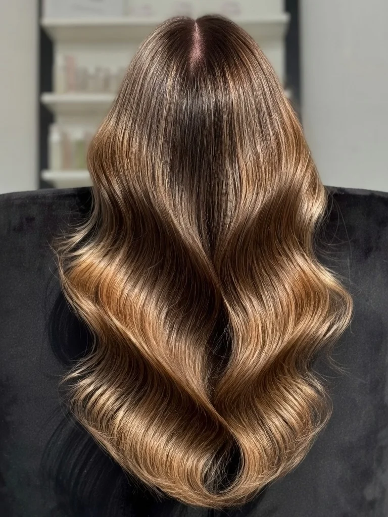 soft summer wavy hairstyle 2026 Glossy Mocha Waves With Luxe Movement