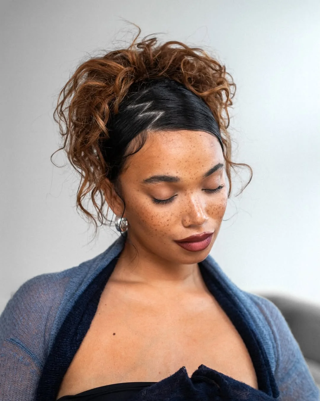 soft summer wavy hairstyle 2026 Curly Summer Updo With Soft Tendrils