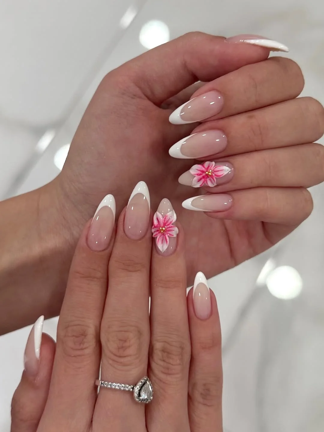 summer french tip nails 2026 Classic White Almond French Nails With Soft Flower Accents