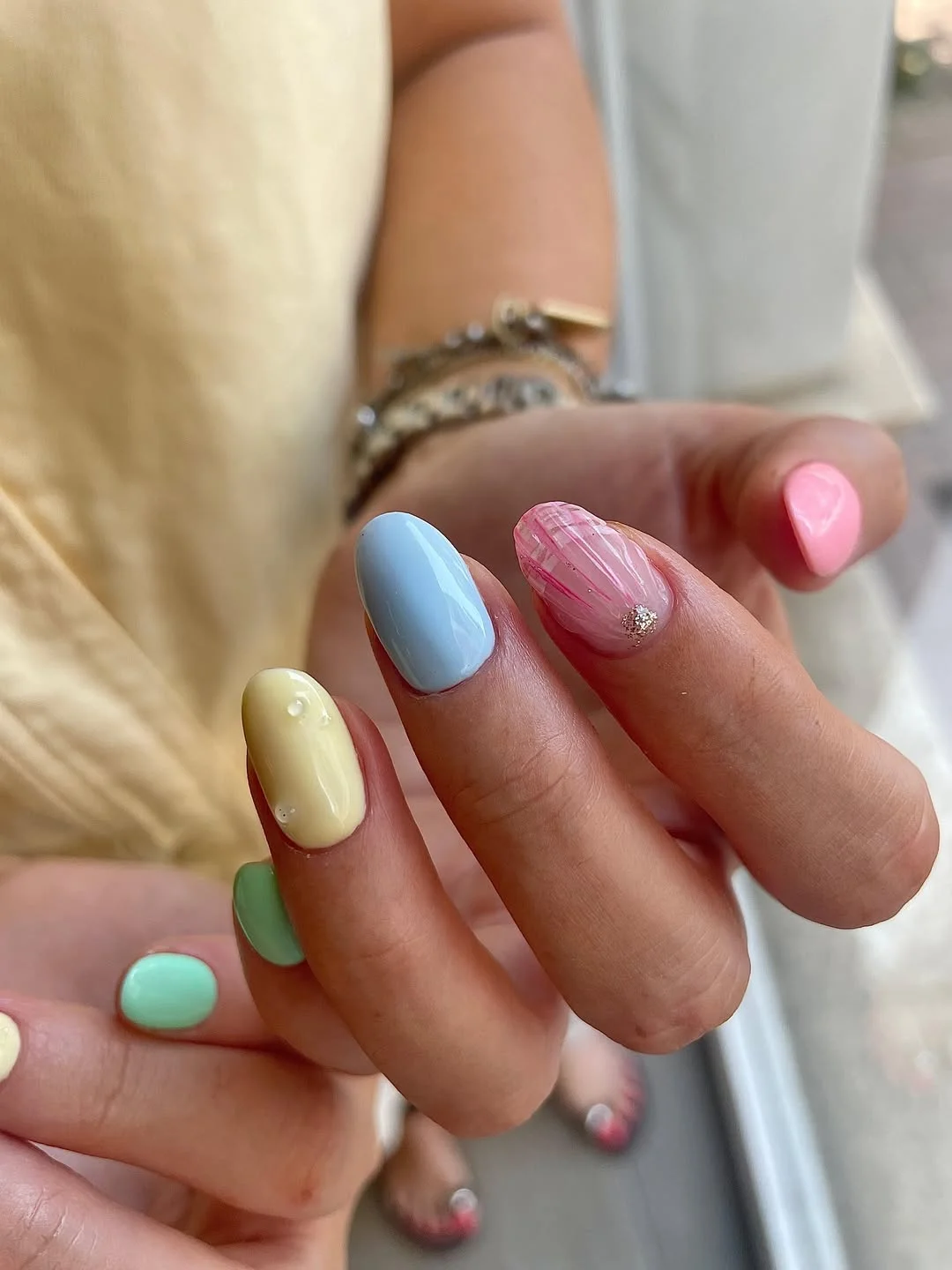 summer manicure color ideas 2026 Pastel Mix Gel Nails with Soft Texture Art
