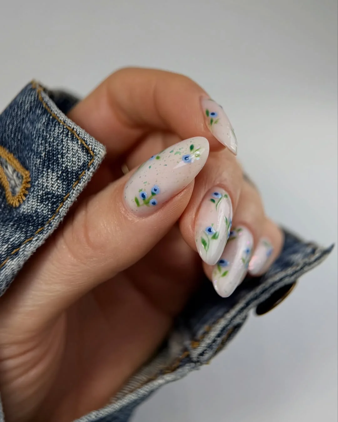 Summer nail art ideas 2026 Tiny Blue Floral Nails with a Fresh Clean Look