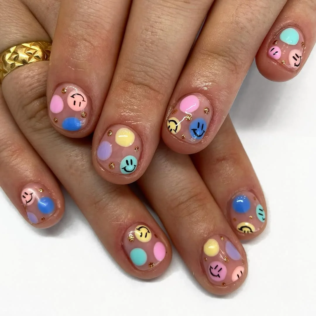 Summer nail art ideas 2026 Pastel Smiley Nails with Fun Y2K Energy