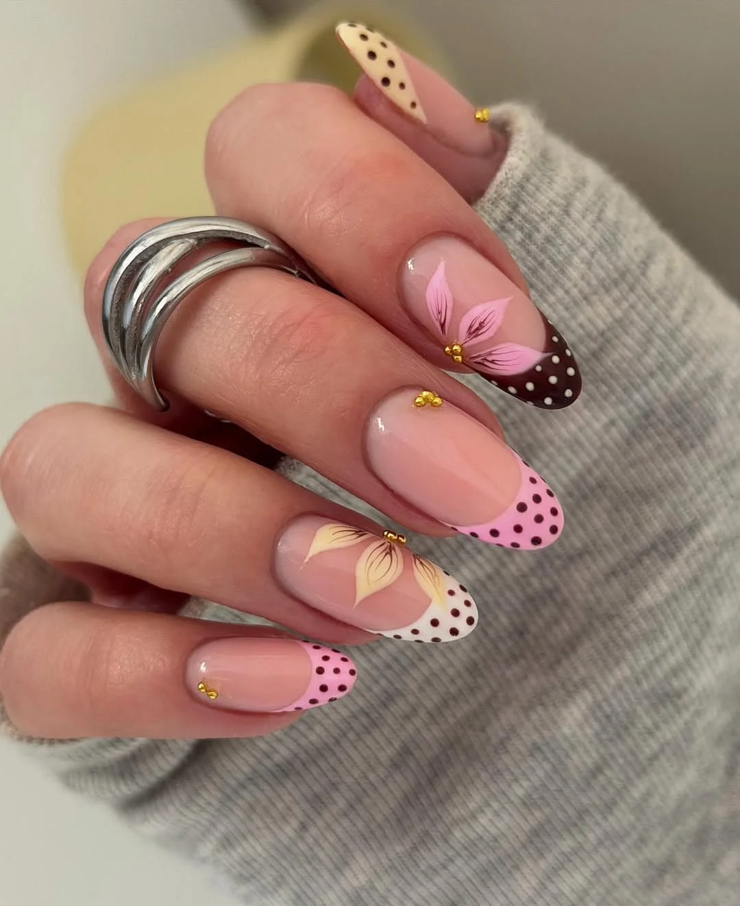 Summer nail art ideas 2026 Pink Polka Dot French Nails with Floral Accents