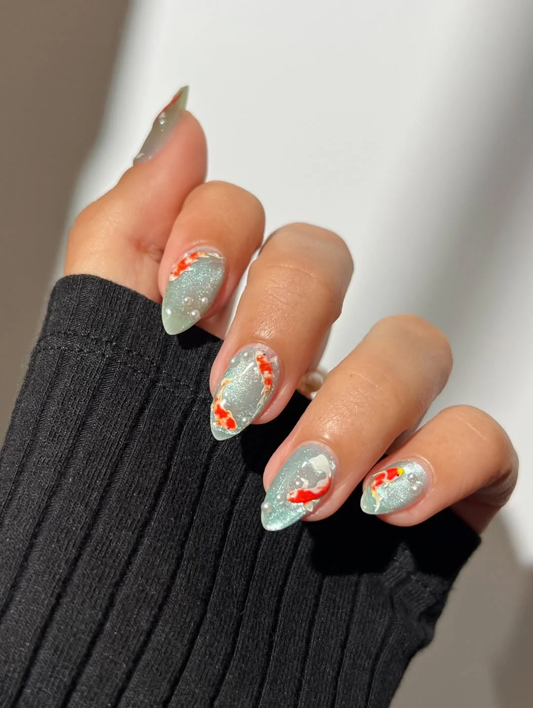 Summer nail art ideas 2026 Soft Blue Koi Fish Nails with Dreamy Water Details