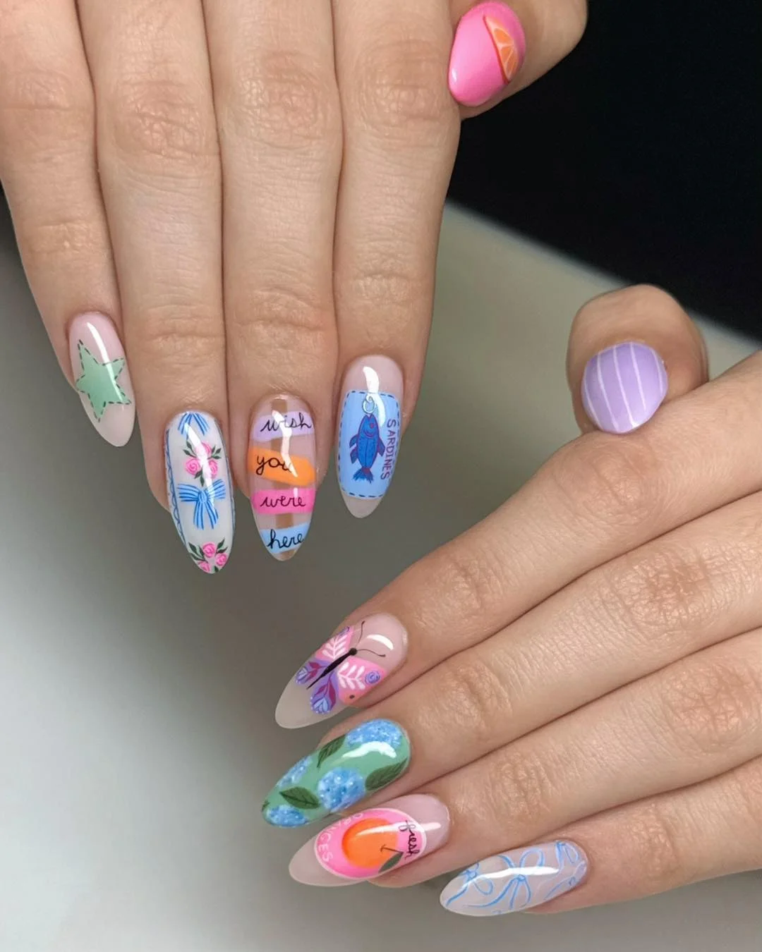 Summer nail art ideas 2026 Eclectic Storybook Nails with Artistic Details