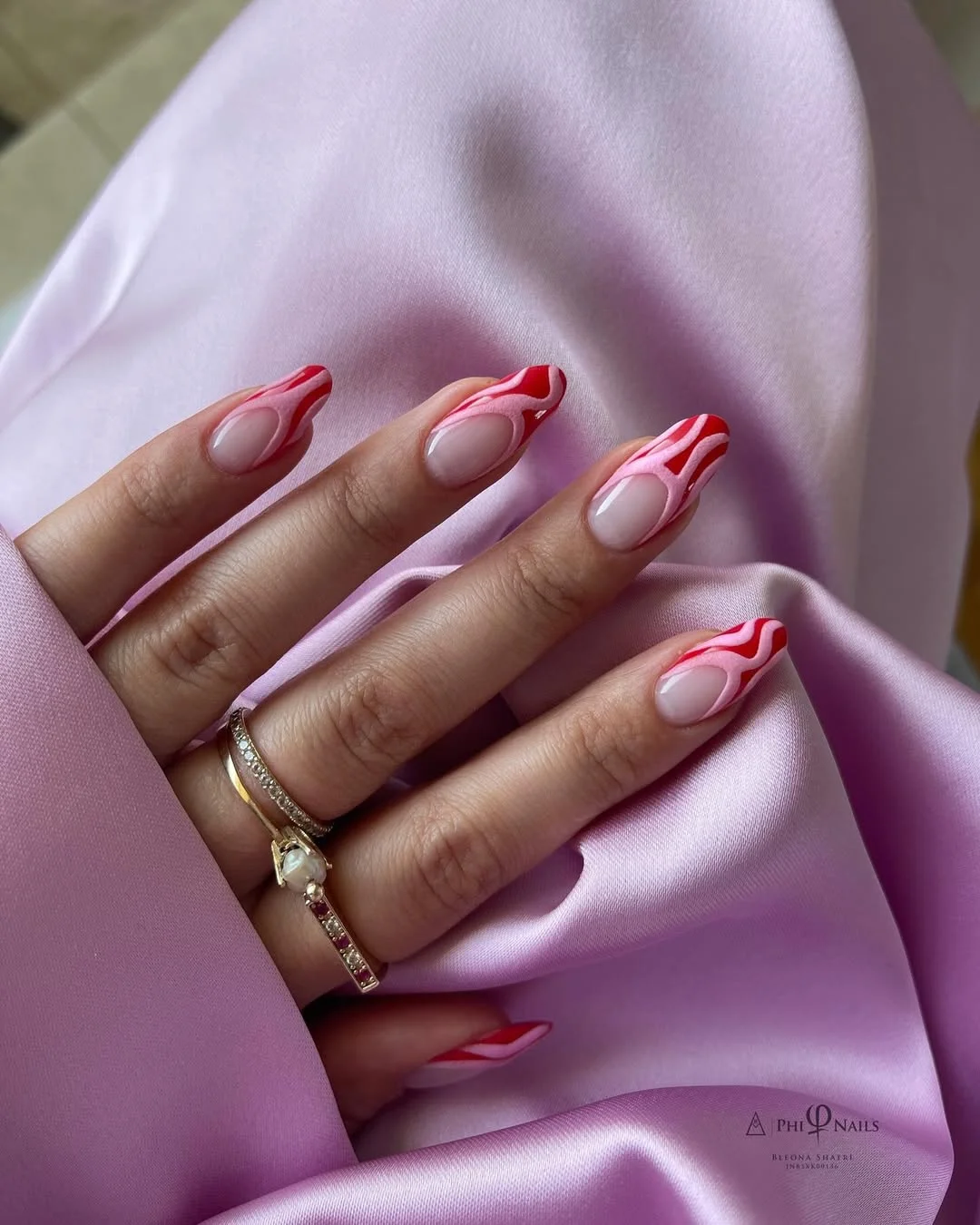 Summer nail art ideas 2026 Pink Swirl French Nails with a Glossy Finish
