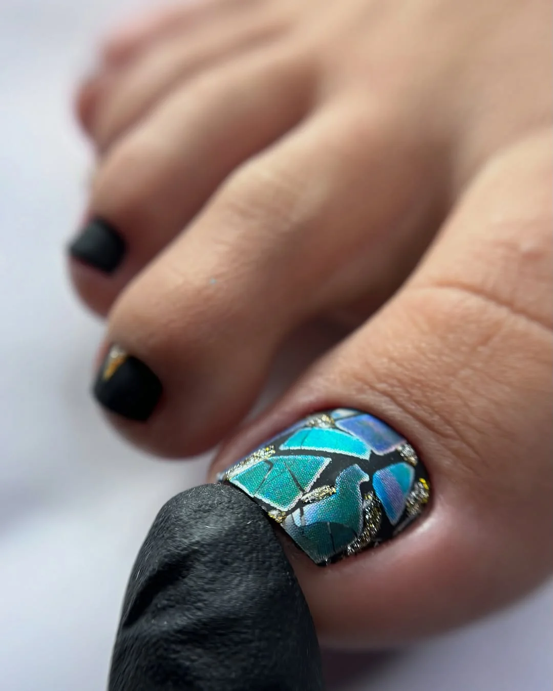 summer pedicure colors 2026 Dark Pedicure With Blue Mosaic Accent