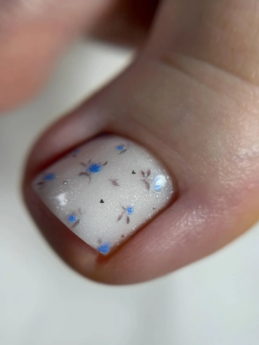 summer pedicure colors 2026 Milky White Micro Floral Pedicure