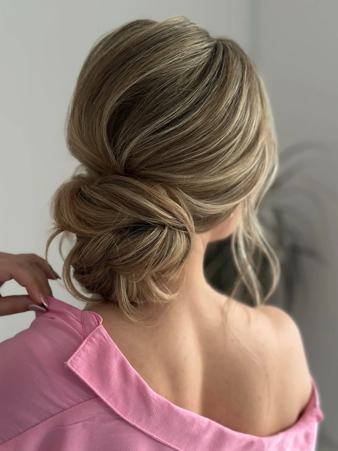summer shag hairstyle 2026 Soft Low Bun With Summer Layers