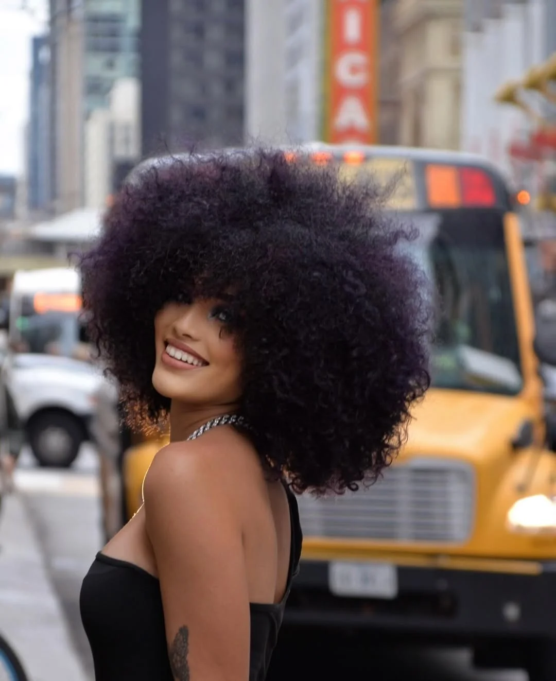summer shag hairstyle 2026 Voluminous Curly Shag With Full Bangs