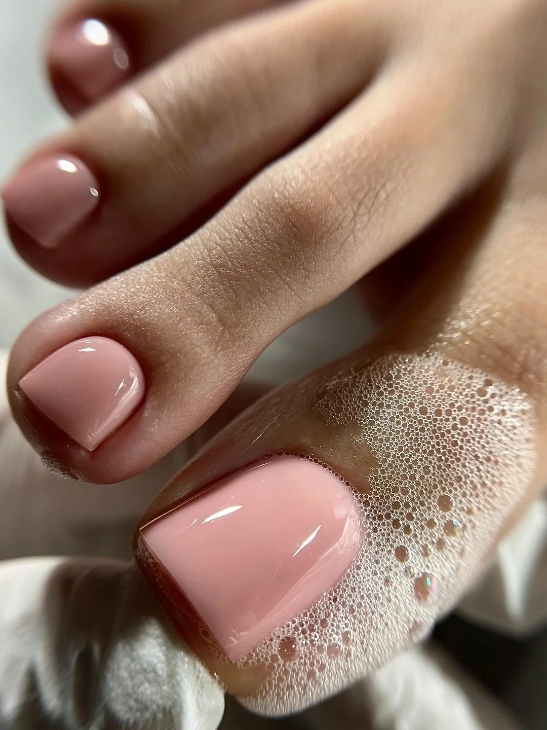summer toe nails colors 2026 Glossy Neutral Pink Pedicure for Everyday Elegance