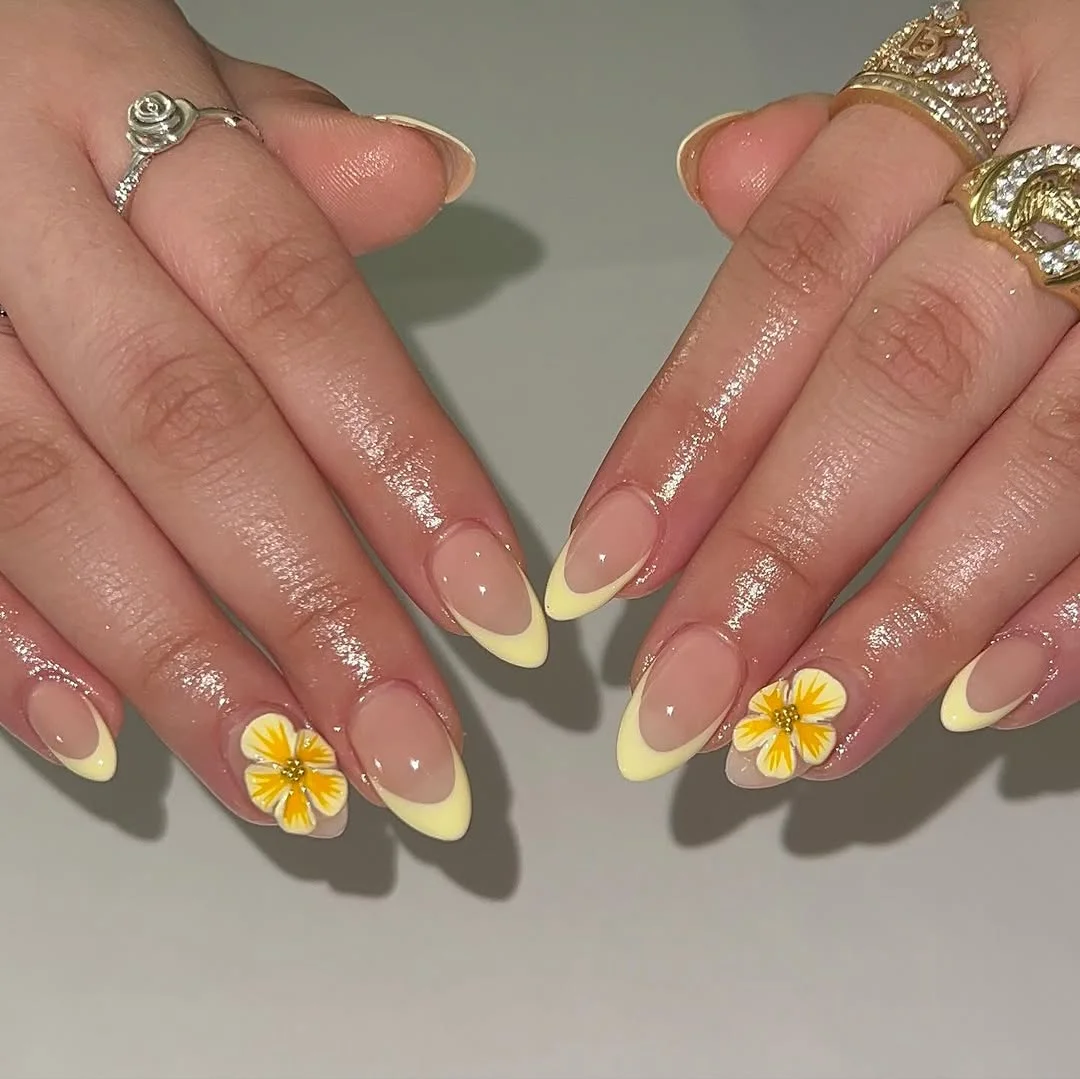 Summer yellow nails 2026 Buttercream French Tips With Floral Accents
