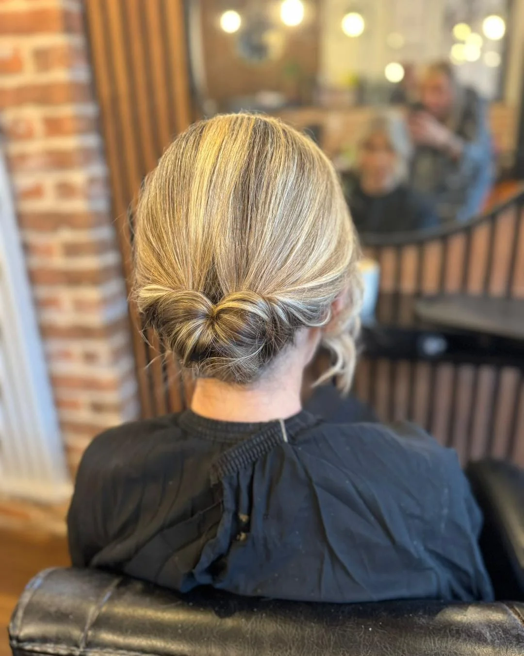 textured summer short hairstyles 2026 Minimal Low Twisted Bun