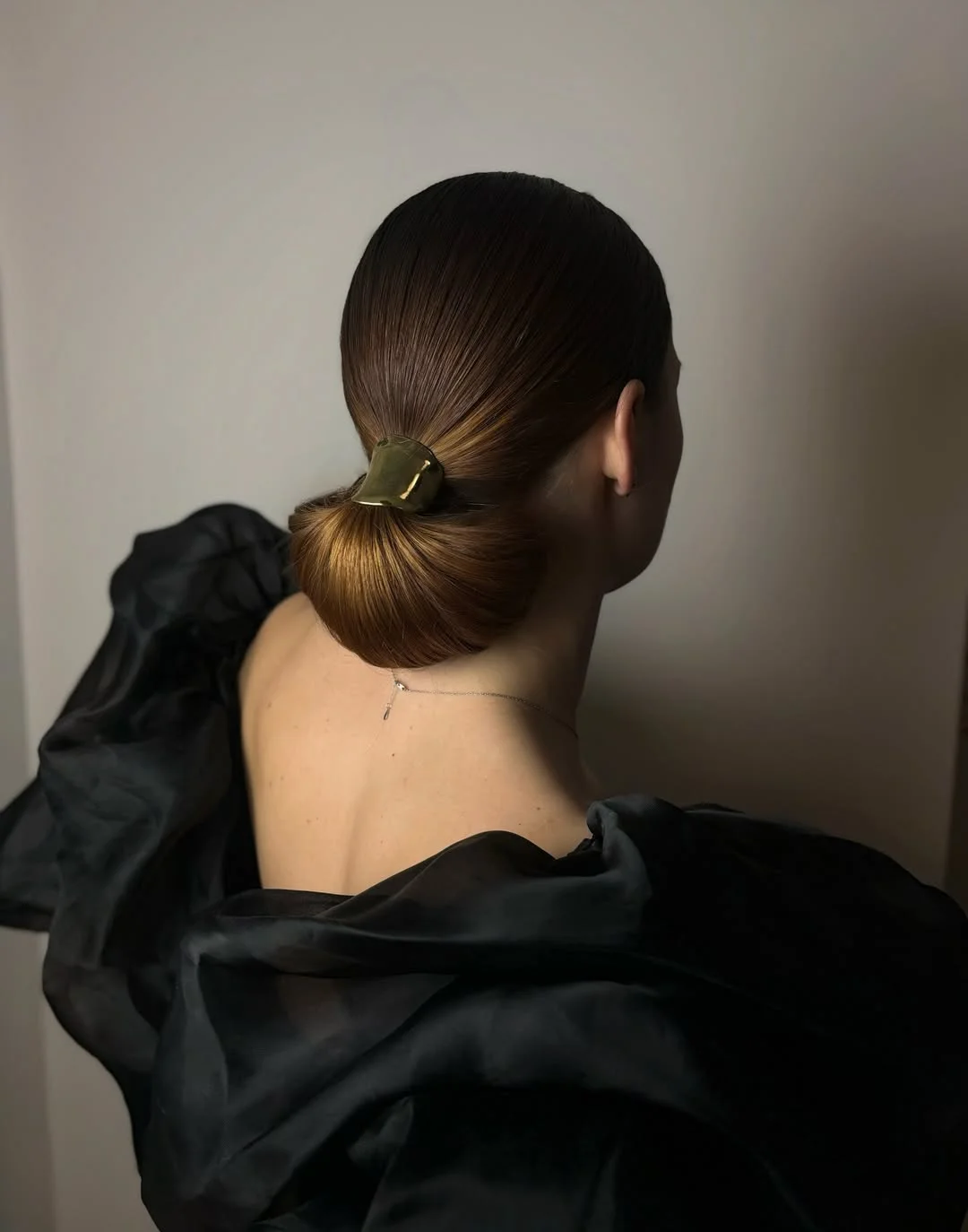 textured summer short hairstyles 2026 Minimal Sleek Low Bun