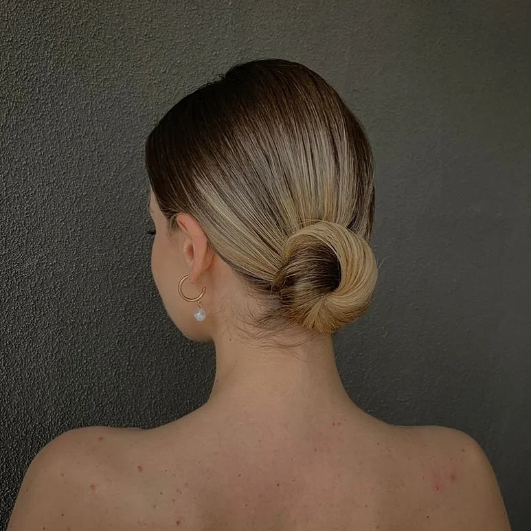 textured summer short hairstyles 2026 Minimal Glossy Low Knot