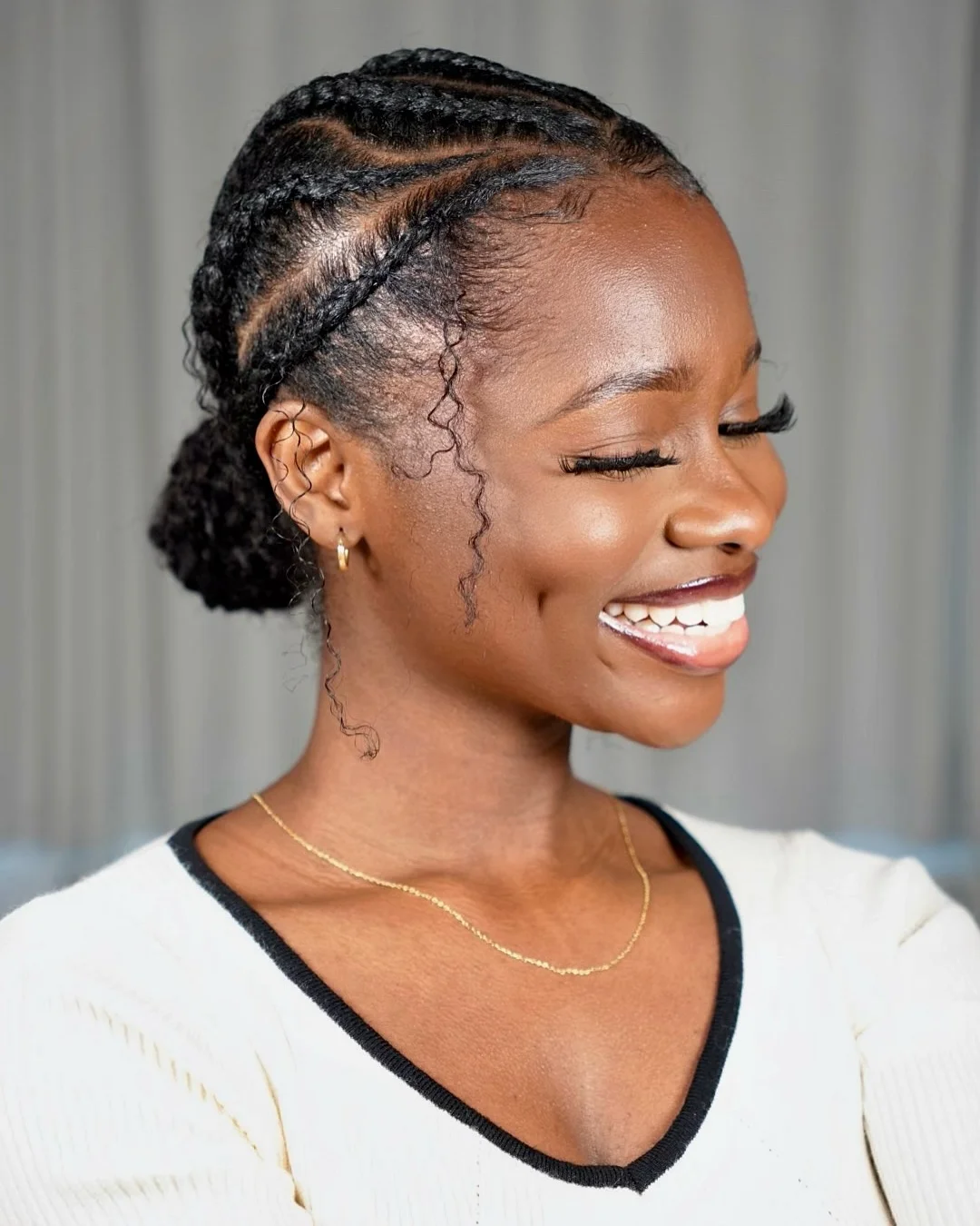 trendy summer hairstyle black women 2026 Clean Braided Low Bun