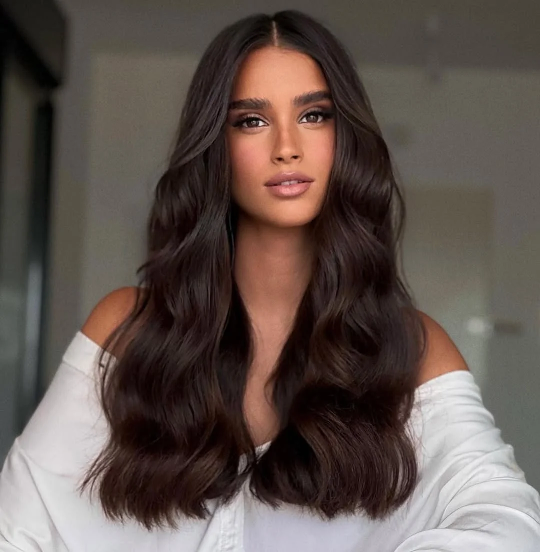 warm summer brunette hair color 2026 Deep espresso brunette with soft volume waves